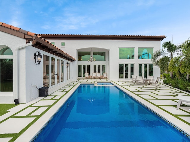 back of house featuring a patio area and french doors