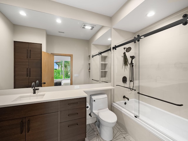 full bathroom featuring combined bath / shower with glass door, toilet, tile patterned floors, and vanity