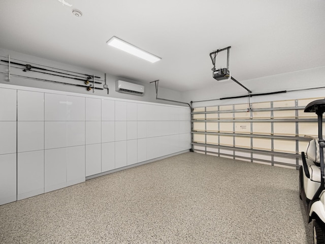 garage with a garage door opener and a wall unit AC