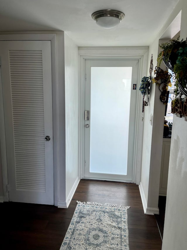 entryway with dark hardwood / wood-style floors