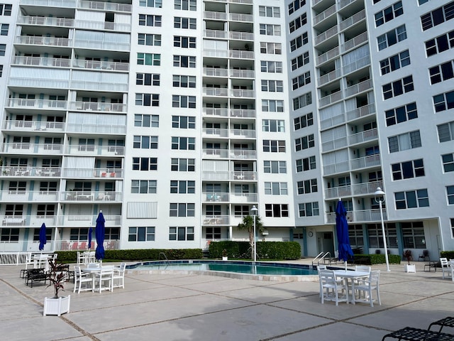 view of property featuring a community pool