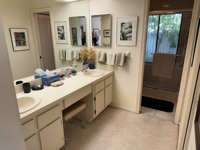 bathroom featuring tile patterned flooring and vanity