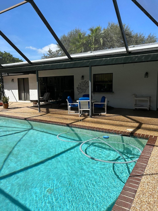 view of pool featuring a lanai and a patio area