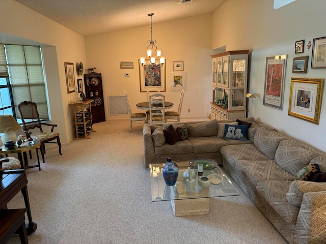 living room with lofted ceiling, carpet floors, a chandelier, and a textured ceiling