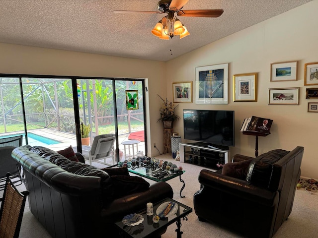 living room with a textured ceiling, a wealth of natural light, and light colored carpet