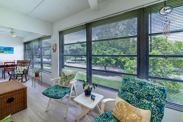 sunroom featuring a healthy amount of sunlight and ceiling fan