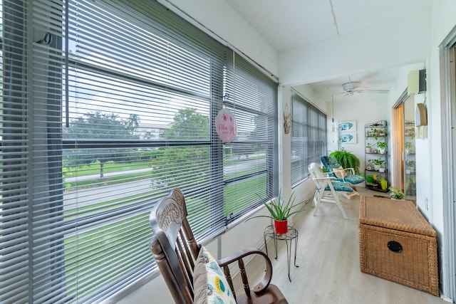 sunroom featuring ceiling fan