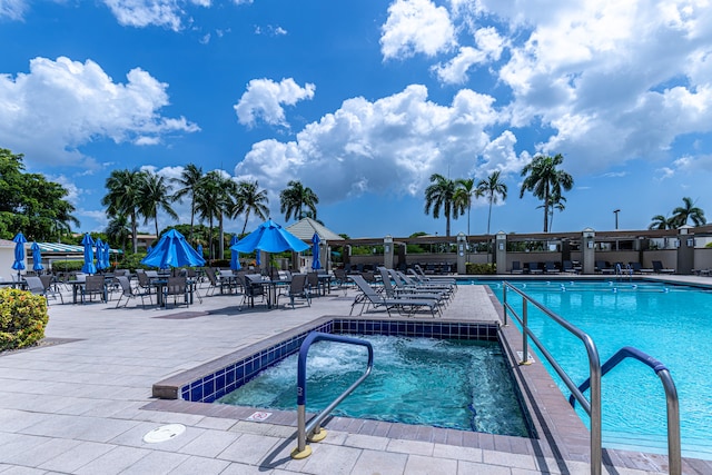 view of swimming pool with a patio