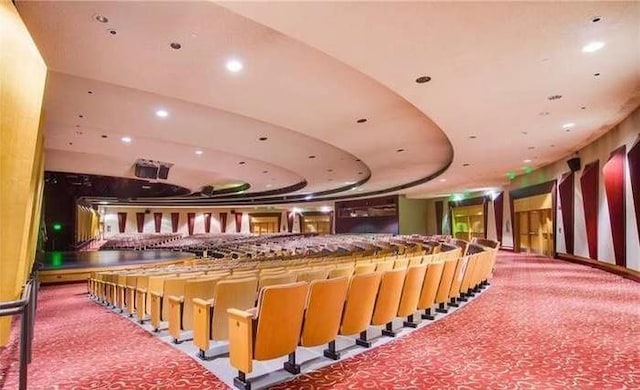 misc room with carpet flooring and a raised ceiling