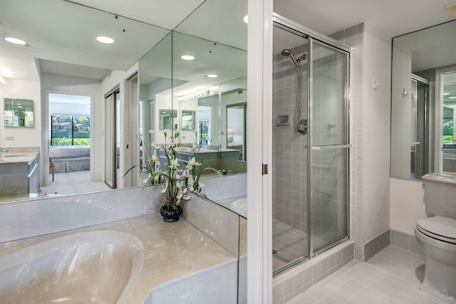 bathroom with tile patterned flooring, toilet, vanity, and a shower with shower door