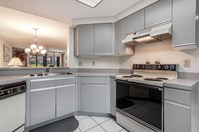 kitchen with sink, white appliances, premium range hood, light tile patterned floors, and gray cabinets