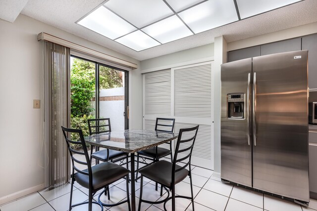 dining room featuring light tile patterned floors