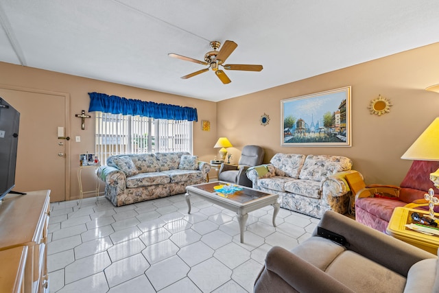 living room featuring ceiling fan and light tile patterned floors