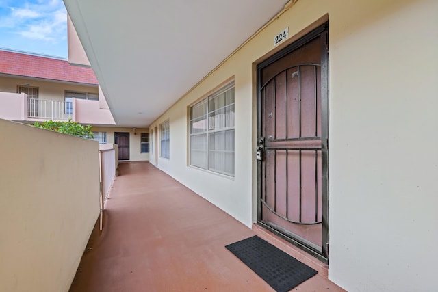 entrance to property with stucco siding