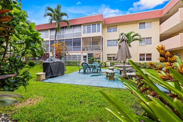 exterior space with a lawn and a patio area