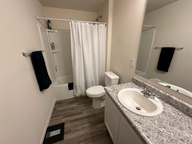 full bathroom featuring shower / tub combo, hardwood / wood-style flooring, toilet, and vanity