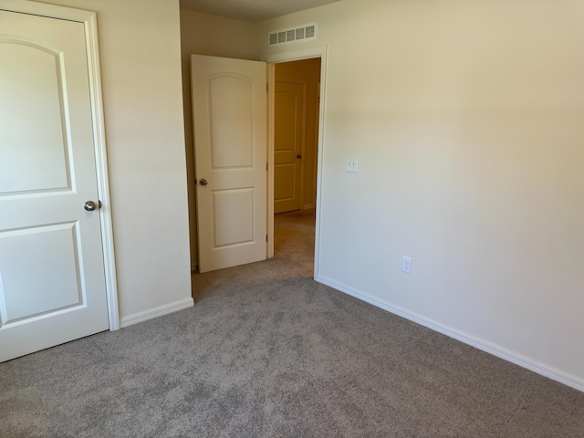 unfurnished bedroom with light carpet