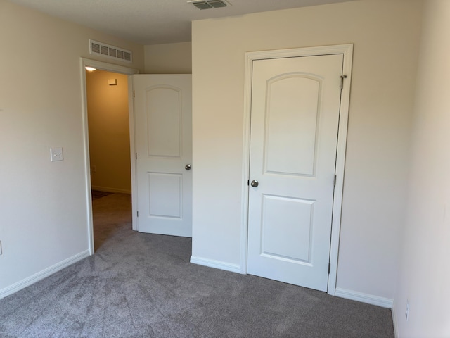 unfurnished bedroom featuring carpet flooring