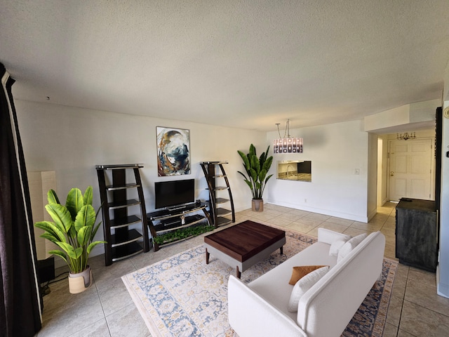 2856 S Garden Dr Unit 201, Lake Worth, FL 33461 - living area with light tile patterned floors and a textured ceiling