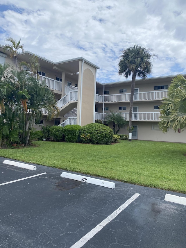 view of property featuring uncovered parking