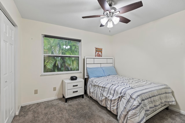 carpeted bedroom featuring a closet and ceiling fan