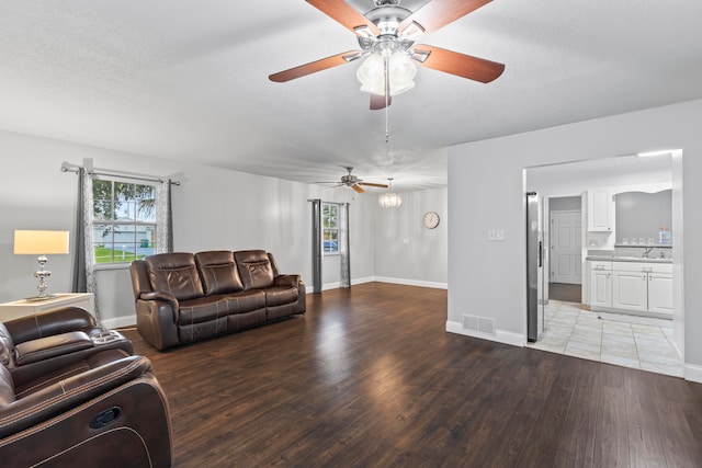 living room featuring hardwood / wood-style floors and a textured ceiling