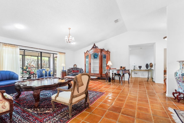 living room featuring tile patterned floors, a chandelier, and vaulted ceiling