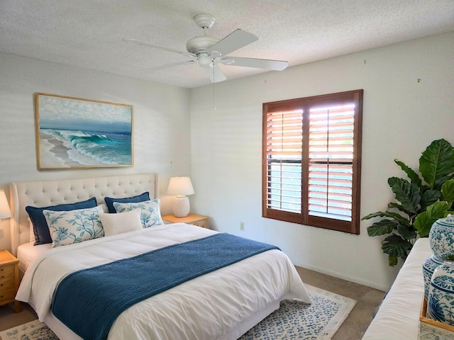 2450 Riviera Dr, Delray Beach, FL 33445 - carpeted bedroom with baseboards, a textured ceiling, and a ceiling fan