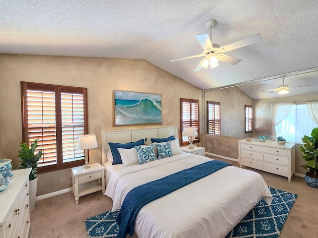 2450 Riviera Dr, Delray Beach, FL 33445 - bedroom with light carpet, multiple windows, and vaulted ceiling