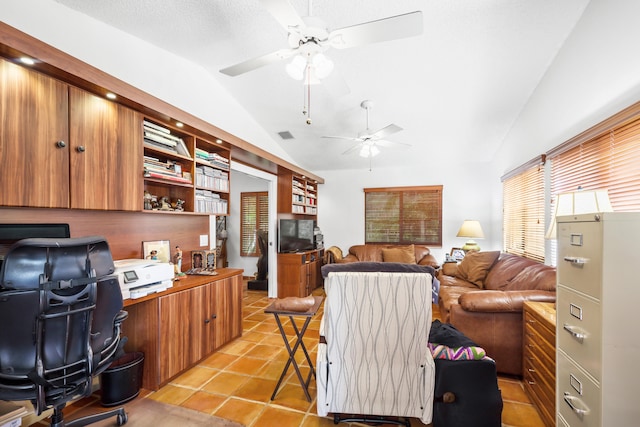 tiled office featuring ceiling fan and lofted ceiling