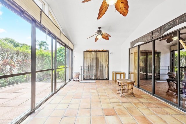 unfurnished sunroom with ceiling fan and lofted ceiling