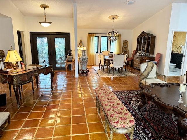 interior space with tile patterned floors, french doors, and an inviting chandelier