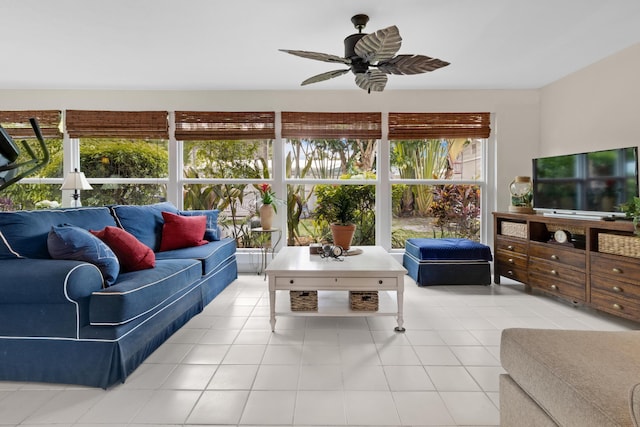 living room with light tile patterned floors, a wealth of natural light, and ceiling fan