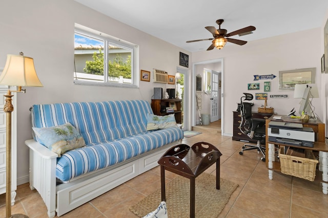 home office with light tile patterned floors and ceiling fan