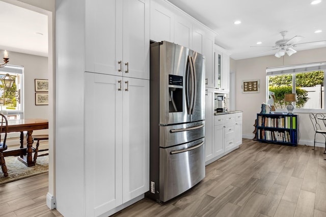 kitchen with white cabinetry, ceiling fan, light hardwood / wood-style floors, and stainless steel refrigerator with ice dispenser