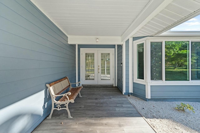 view of exterior entry featuring french doors