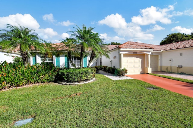 mediterranean / spanish-style home featuring a garage and a front lawn