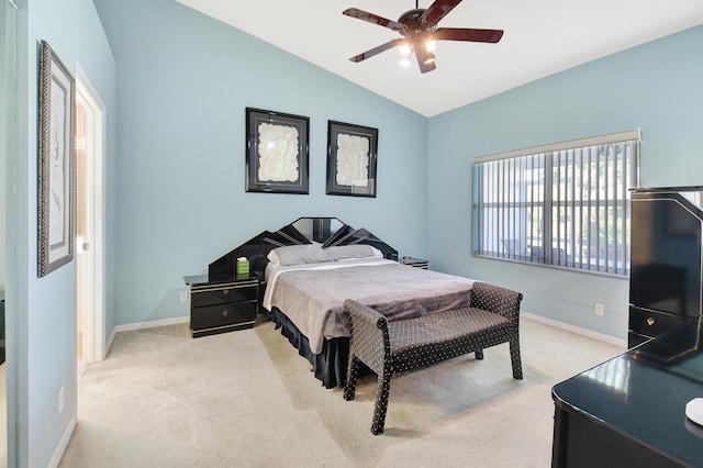 carpeted bedroom featuring lofted ceiling and ceiling fan