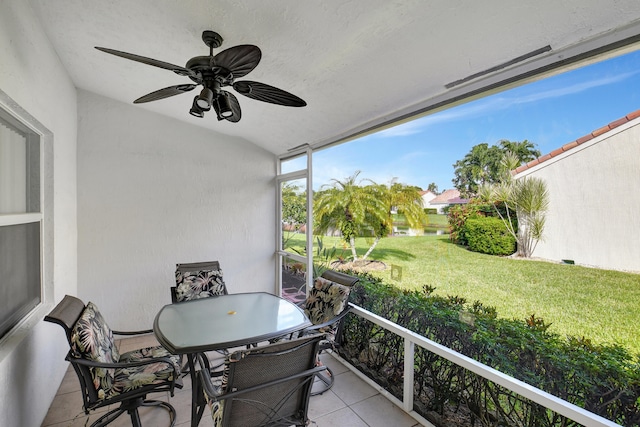 exterior space with ceiling fan