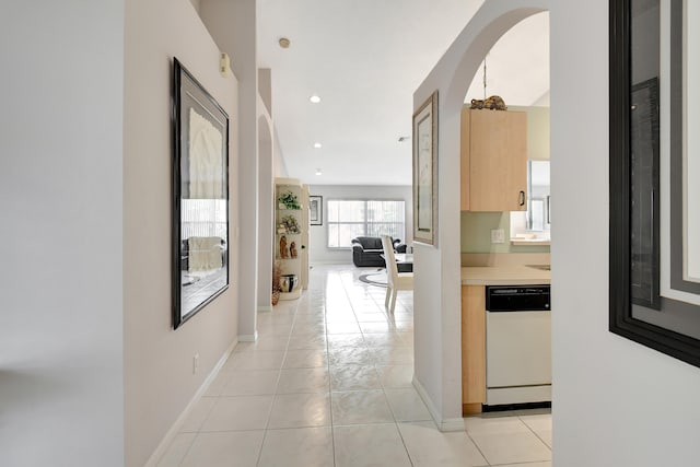 hallway featuring light tile patterned floors