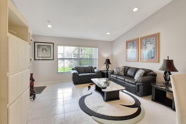 living room with light tile patterned floors and vaulted ceiling