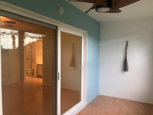 interior space featuring ceiling fan and light tile patterned floors