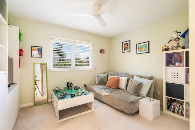 carpeted living room with ceiling fan