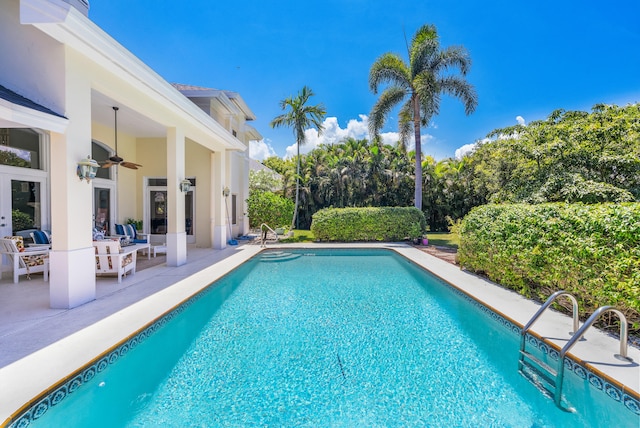 view of pool featuring ceiling fan and a patio area