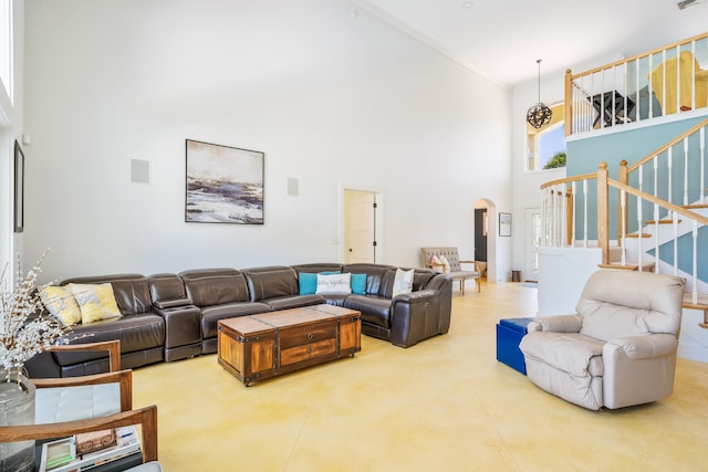 living room featuring a high ceiling