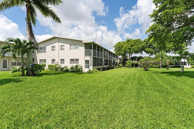 view of yard featuring a sunroom