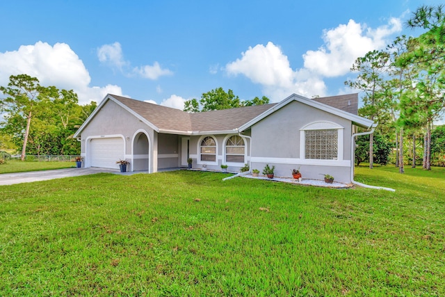 single story home featuring a garage and a front lawn