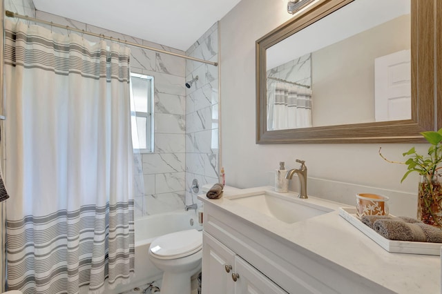 full bathroom featuring shower / bath combo, toilet, and vanity