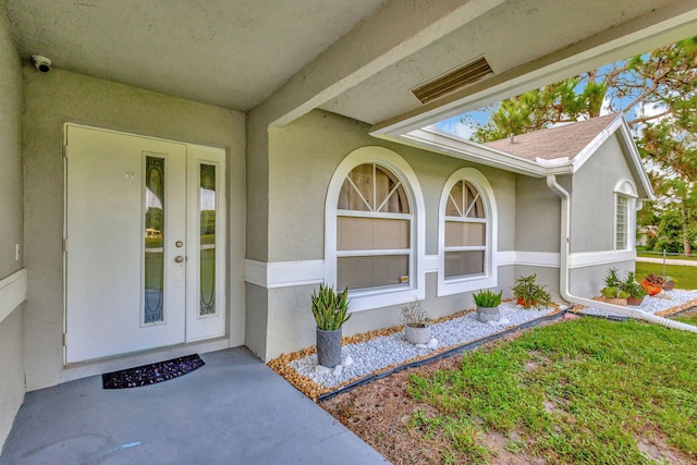 property entrance featuring french doors