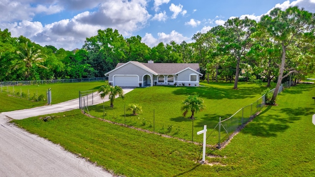 view of front of house with a garage and a front yard